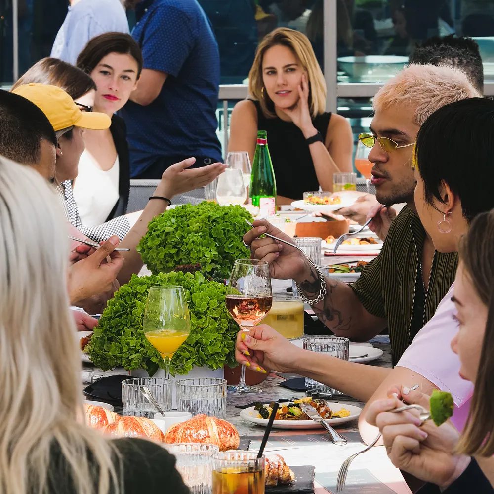 A sunny rooftop lunch with watercress centerpieces